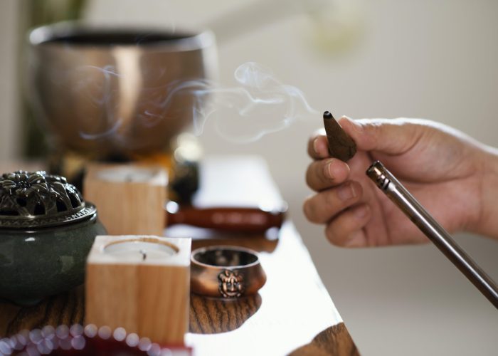 side-view-man-lighting-incense